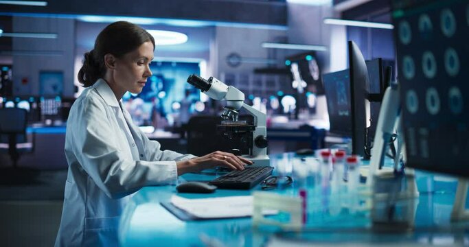 Medical Research And Development Center: Caucasian Female Scientist Using Microscope To Analyze Petri Dish Sample. Specialist Developing Innovative Medicine For Rehabilitation Of Patients After Stroke