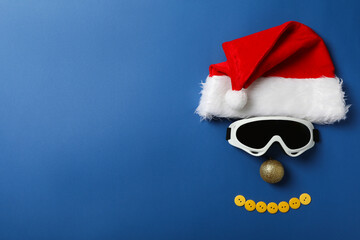 Santa hat with ski goggles and a decorative ball