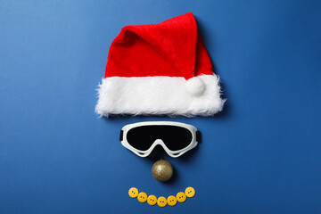 Santa hat with ski goggles and a decorative ball