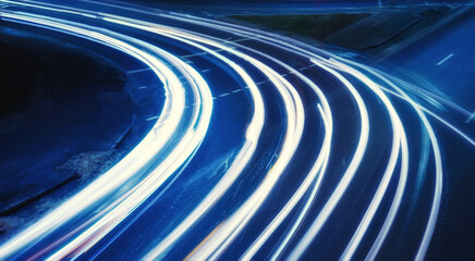 Road with headlights at night, long exposure headlights, night city.