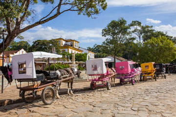 Cart and horse on a street in the city of Tiradentes, Minas Gerais, Brazil. Old wagon for a ride in the historic colonial city
