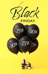 Obraz premium Many balloons, gifts and text BLACK FRIDAY on yellow background