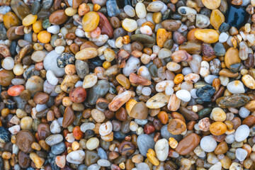 Close up colorful pebble stones at the beach in Porto, Portugal.
