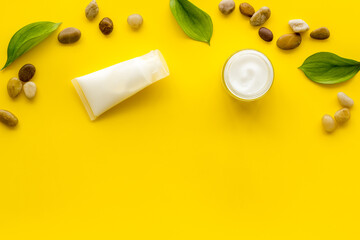 Layout of cosmetic moisturizer face skin cream in glass vial, top view