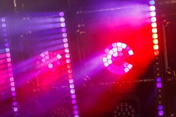 Red and lilac light from lighting fixtures and heavy smoke demonstration