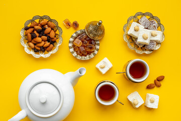 Traditional Turkish delight with tea on table, top view