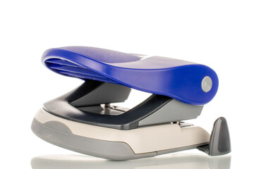 One office hole punch, macro, isolated on white background.