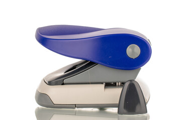 One office hole punch, macro, isolated on white background.