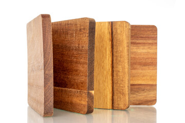 Set of four wooden coasters made of pine, macro, isolated on white background.