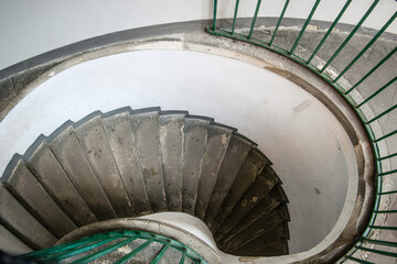 Vintage spiral staircase with metal green railings