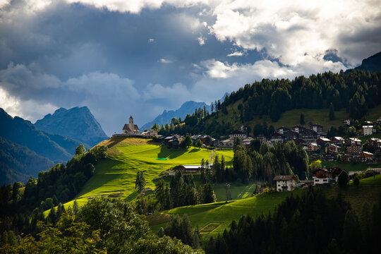 Picturesque view of Rocca Pietore village, with his small church  located at the foot of the Marmolada and in the Center of the Dolomites