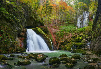 Vibrant landscape of a waterfall in a gorge