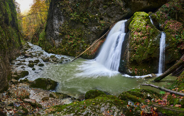 Vibrant landscape of a waterfall in a gorge