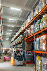 Fototapeta premium Warehouse man worker with forklift.