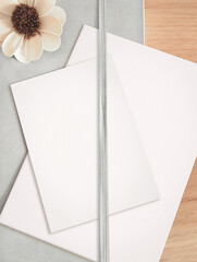 Top view sheet on desk, Empty White Sheets on Wooden Table - Flat lay mockup, note book background...