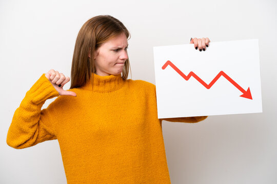 Young English woman isolated on white background holding a sign with a decreasing statistics arrow symbol and doing bad signal