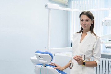 young beautiful female dentist portrait in a dental studio