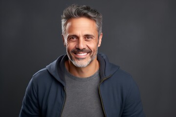 Obraz premium Mature smiling man studio portrait. AI generative