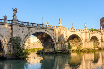 Fototapeta na wymiar St. Angel bridge (Ponte Sant'Angelo) over Tiber river in Rome, Italy