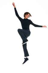 Full length portrait of attractive curly man jumping of joy, happiness isolated white studio background. Concept of beauty, youth, sales, emotions, fashion, style, modelling. Copy space for ad, text.