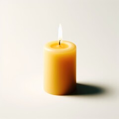 Obraz na płótnie Canvas yellow candle on a white
