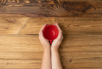 Hand Holds Cup, Empty Red Cup in Hands, Coffee Mug, Teacup, Hot Beverage Mockup