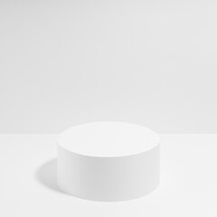 Abstract white scene with one cylinder podium template for presentation cosmetic products, goods, advertising, design, poster, text. White stage template soft light contemporary minimal style, square.
