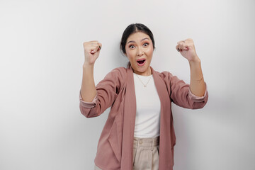 Fototapeta premium A young Asian woman employee with a happy successful expression wearing cardigan isolated by white background