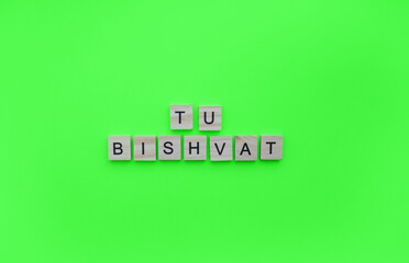 February 6, New Year of fruit trees, Tu Bi-Shvat, minimalistic banner with the inscription in wooden letters