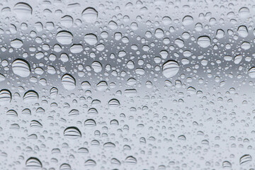 Water drops on the glass as an abstract background. Shallow DOF