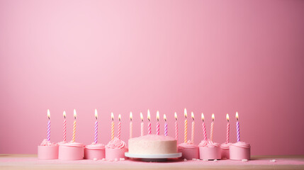 birthday cake and candles pink background