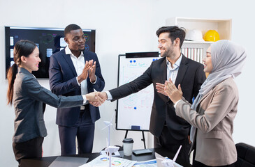 Executives holding hands congratulated the meeting.