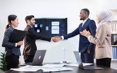Executives holding hands congratulated the meeting.