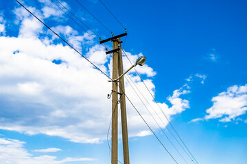 Power electric pole with line wire on colored background close up