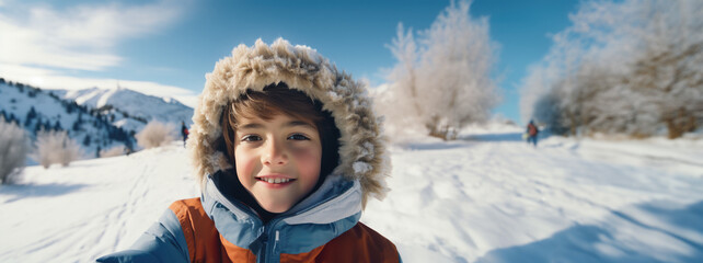 Fototapeta na wymiar Selfie of cute young boy in a wintery outdoors scene, generative ai. 