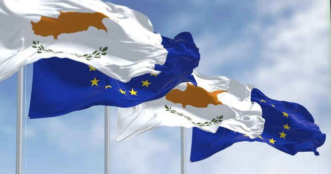 Cyprus national flag waving in the wind with the EU flag on a clear day