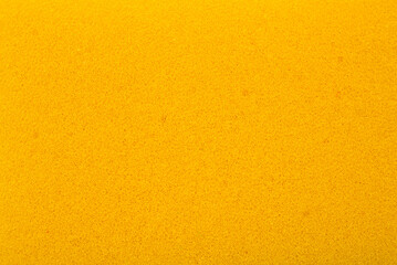 Fototapeta premium The yellow texture of the sponge closeup