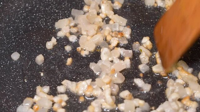 roasting of salted pork fatback on a red-hot pan, close-up	
