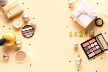 Christmas composition with different makeup products and gift boxes on beige background