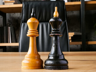 Two chess kings in the office as a symbol of leadership, rivalry and business negotiations.