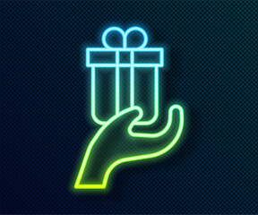 Glowing neon line Give gift icon isolated on black background. Gift in hand. The concept of giving and receiving a gift. Vector