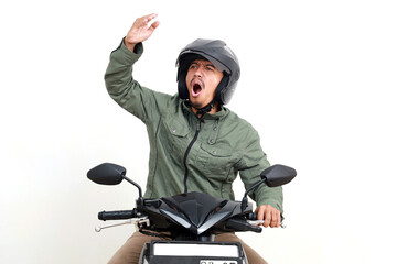 Angry asian man shouting while riding a motorcycle. Isolated on white background