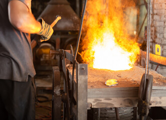 Ferrous metal billet is melted in an induction furnace closeup
