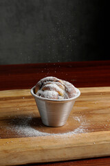 Chocolate muffin in a cup on the table food photography