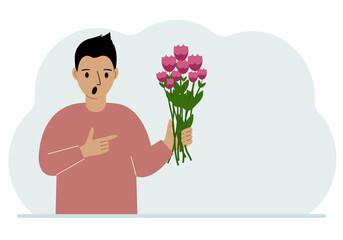 A man is holding a large bouquet of flowers. The concept of a holiday, congratulations, romance or gift.