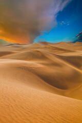 Fototapeta na wymiar Singing sand dune at sunset.