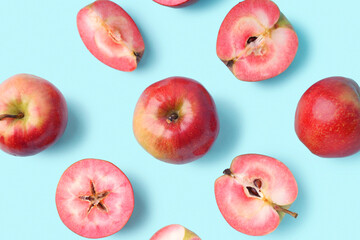Sweet pink apples on blue background