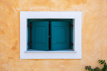 Green window on a Greek traditional house