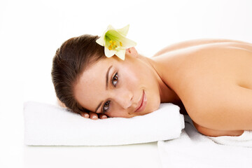 Happy woman, portrait and relax with flower in spa, zen or massage isolated on a white studio background. Face of female person or model smile in skincare for health body therapy, salon or treatment - obrazy, fototapety, plakaty