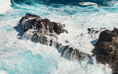 waves crashing on rocks